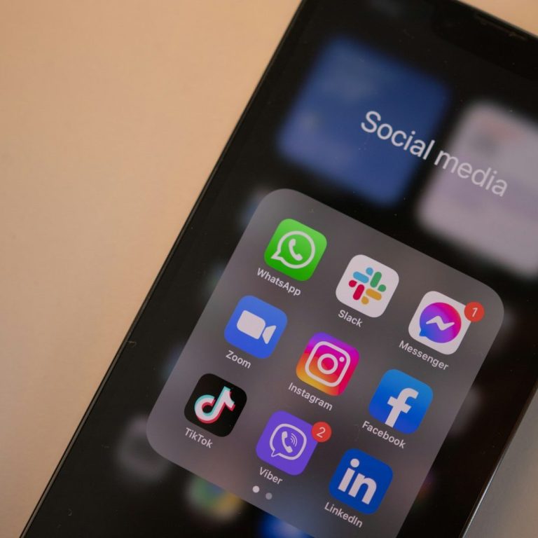 Social Networking/Media Fearures Smartphone screen displaying social media apps including WhatsApp, Instagram, and Facebook.